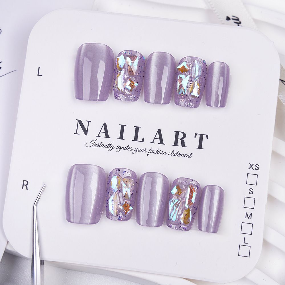 Acrylic nails with glitter accents and modern designs Bowlift