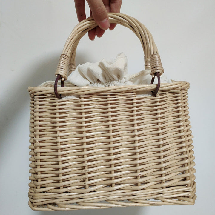 Women's handbag made of braided material with cotton drawstring closure Bowlift