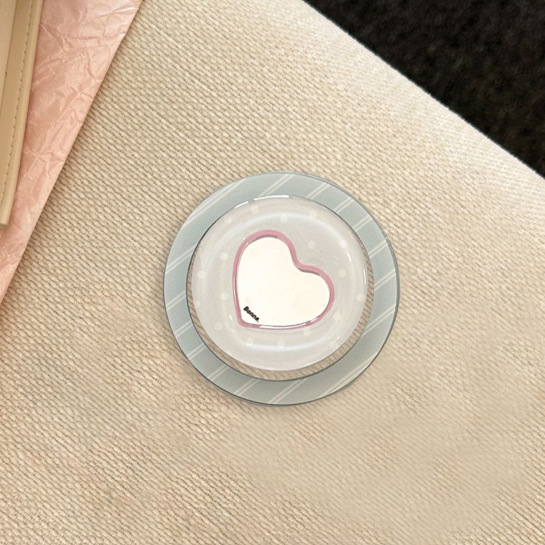 Heart-shaped coaster with playful design Bowlift