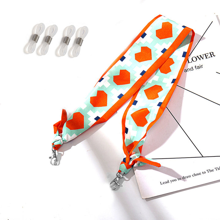 Fashionable fabric mask holder with floral motifs Bowlift