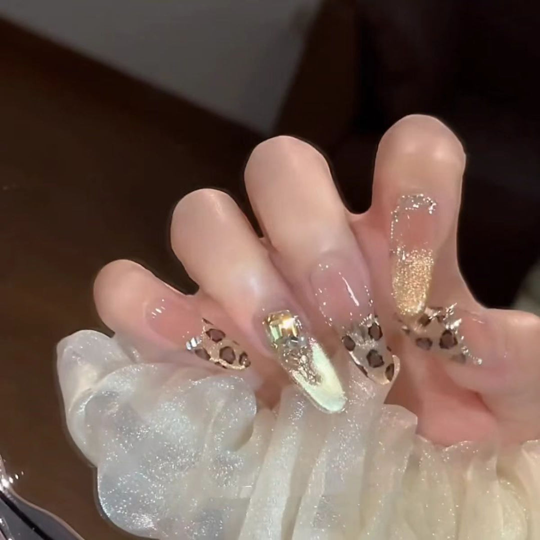Glamorous artificial nails with elegant glitter accents and leopard details Bowlift