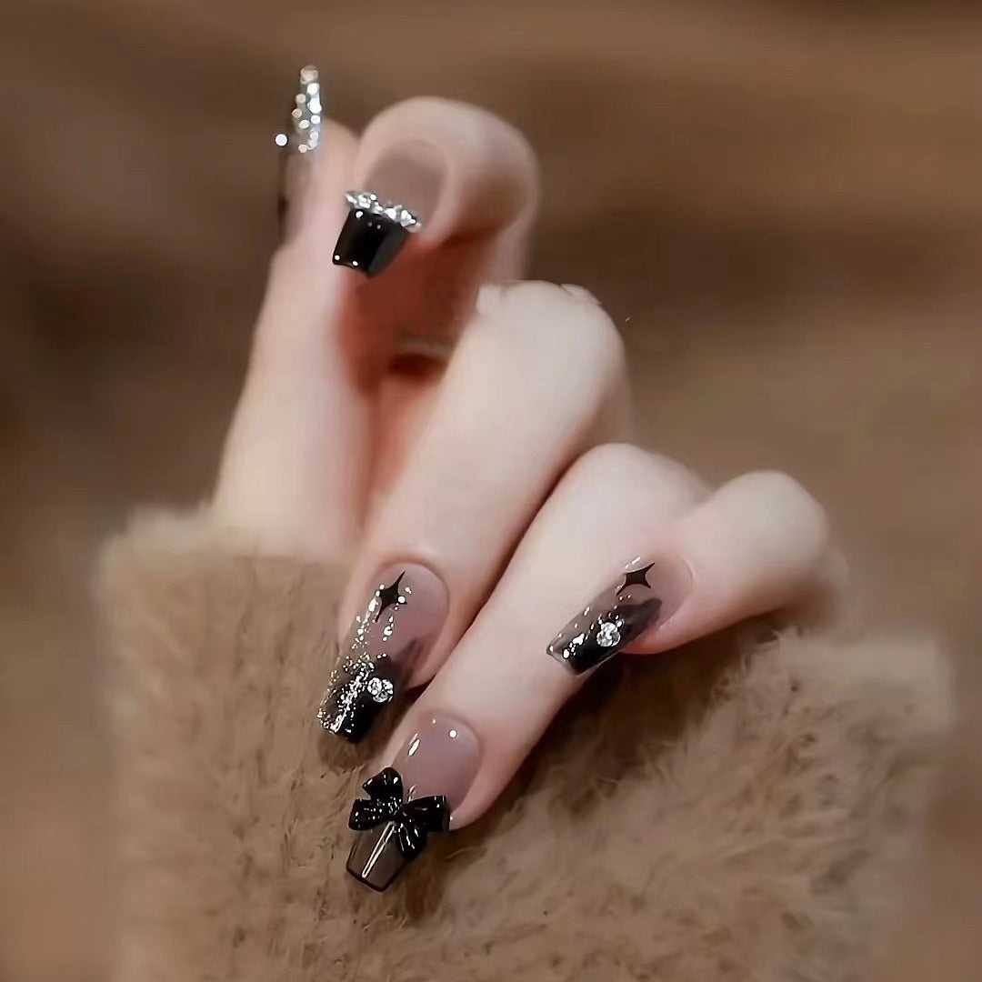 Artificial nails with heart and glitter accents Bowlift
