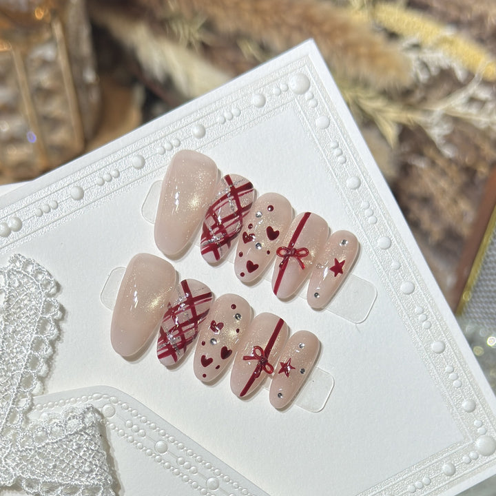 Romantic Themed Press-On Nail Set with Heart and Bow Accents Bowlift