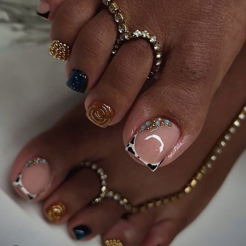 Artful toenail design with floral and sparkling accents Bowlift