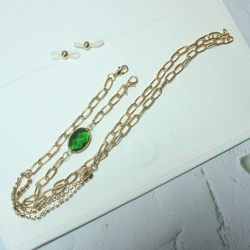 Elegant necklace with green stone and golden accents Bowlift