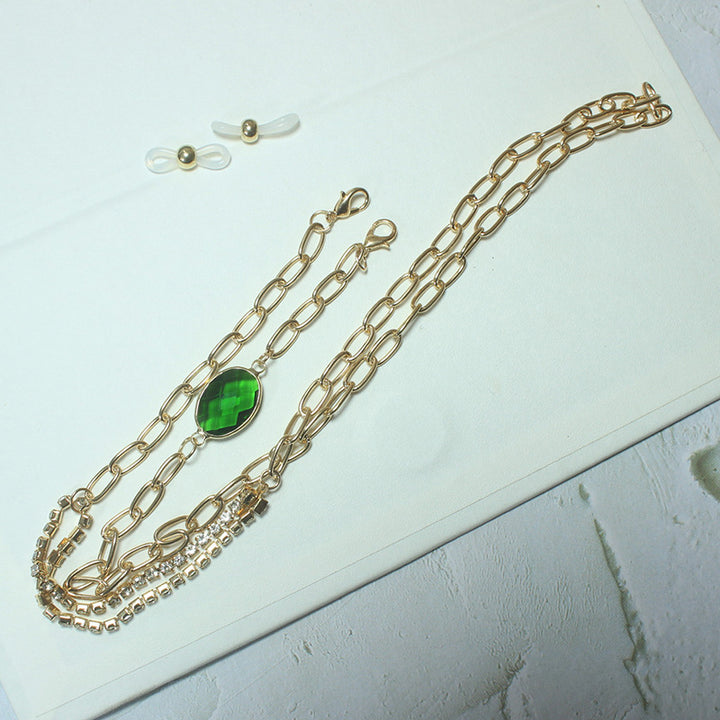 Elegant necklace with green stone and golden accents Bowlift
