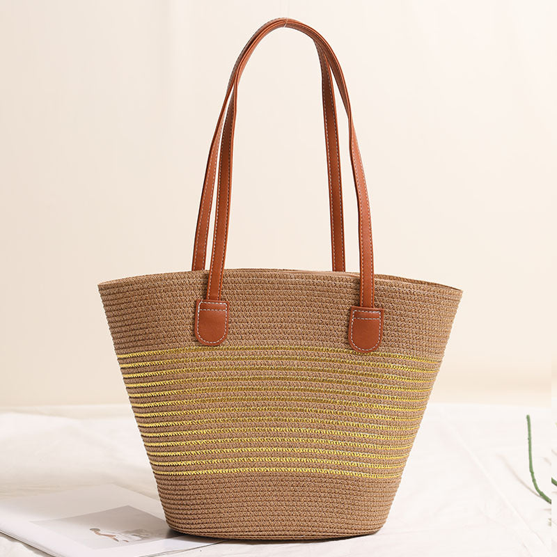 Elegant bast handbag with leather accents Bowlift