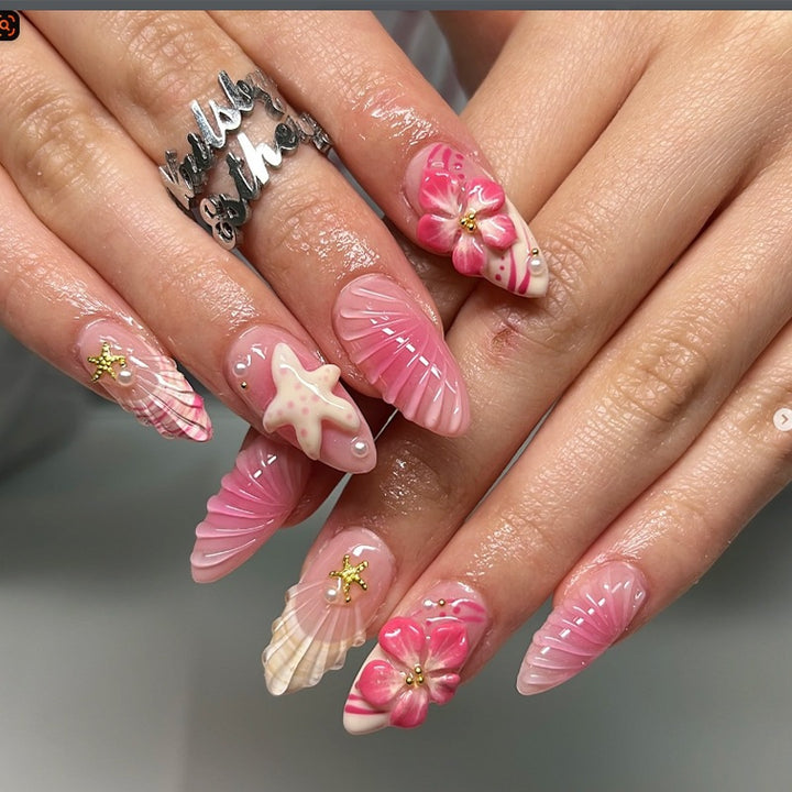 Artificial nail set with maritime shell and flower design Bowlift