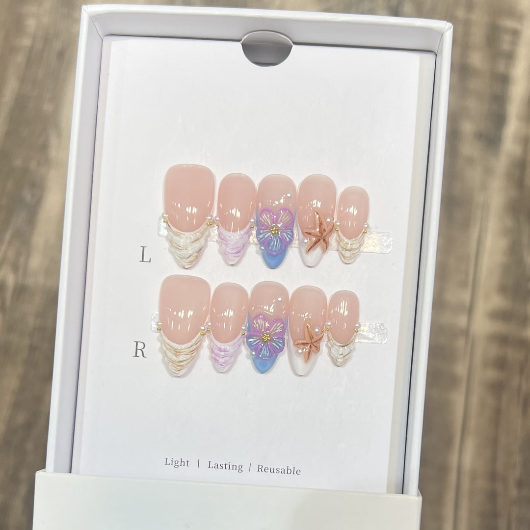 Artistic Press-On Nail Art Set with Floral and Starfish Design Bowlift