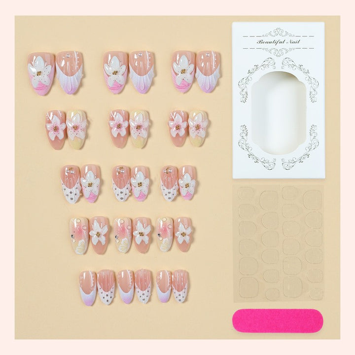 Nail art set with elegant floral design and glitter accents Bowlift