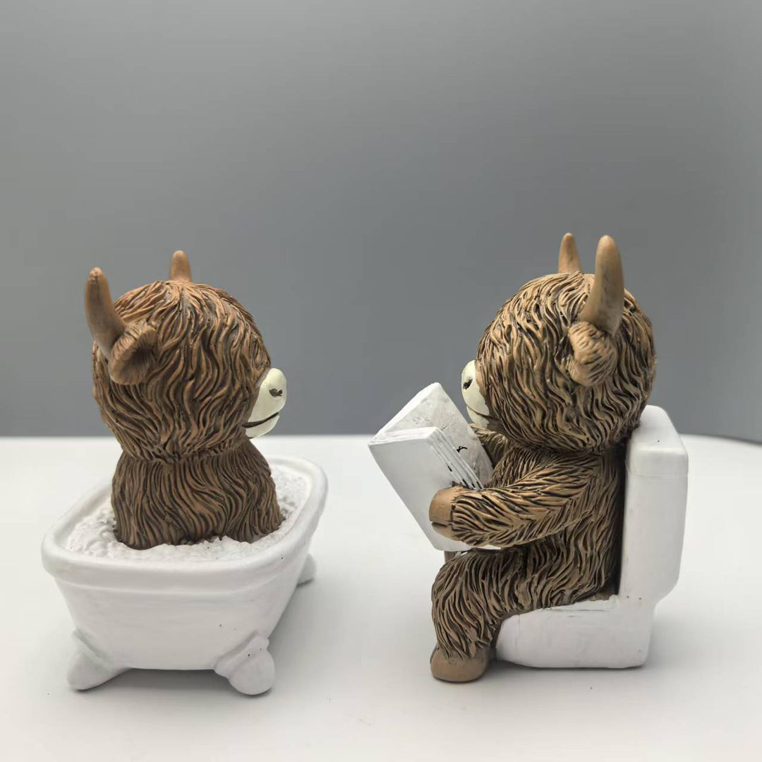 Funny decorative figure of a Highland cow in a bathtub Bowlift