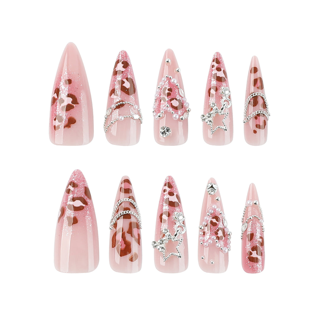 Artistic stiletto nails with glitter and jewelry accents Bowlift