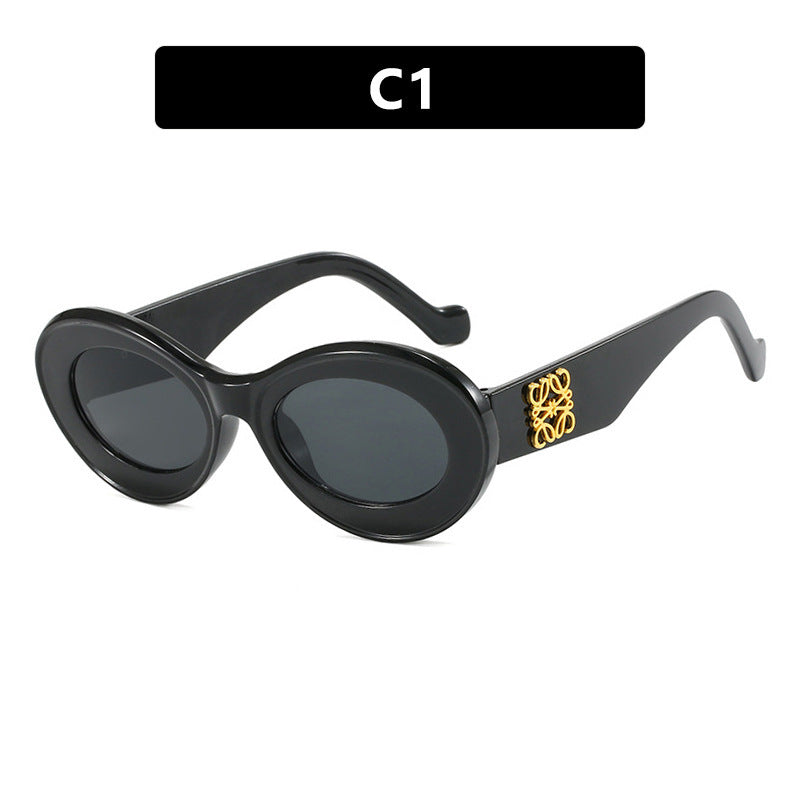 Women's fashionable sunglasses with oval frame and golden accents Bowlift