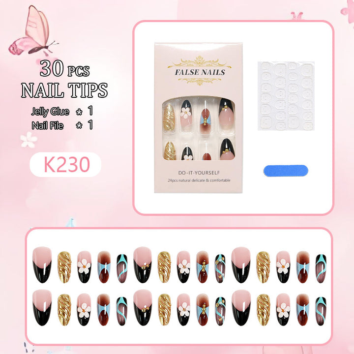 Artificial nail set with filigree floral decorations and glamorous accents Bowlift