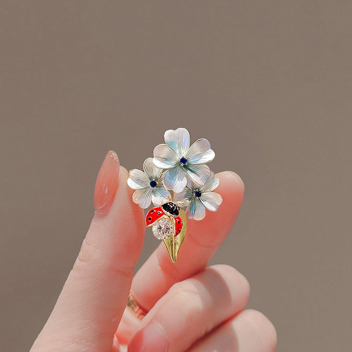 Flower brooch with ladybug and crystal Bowlift