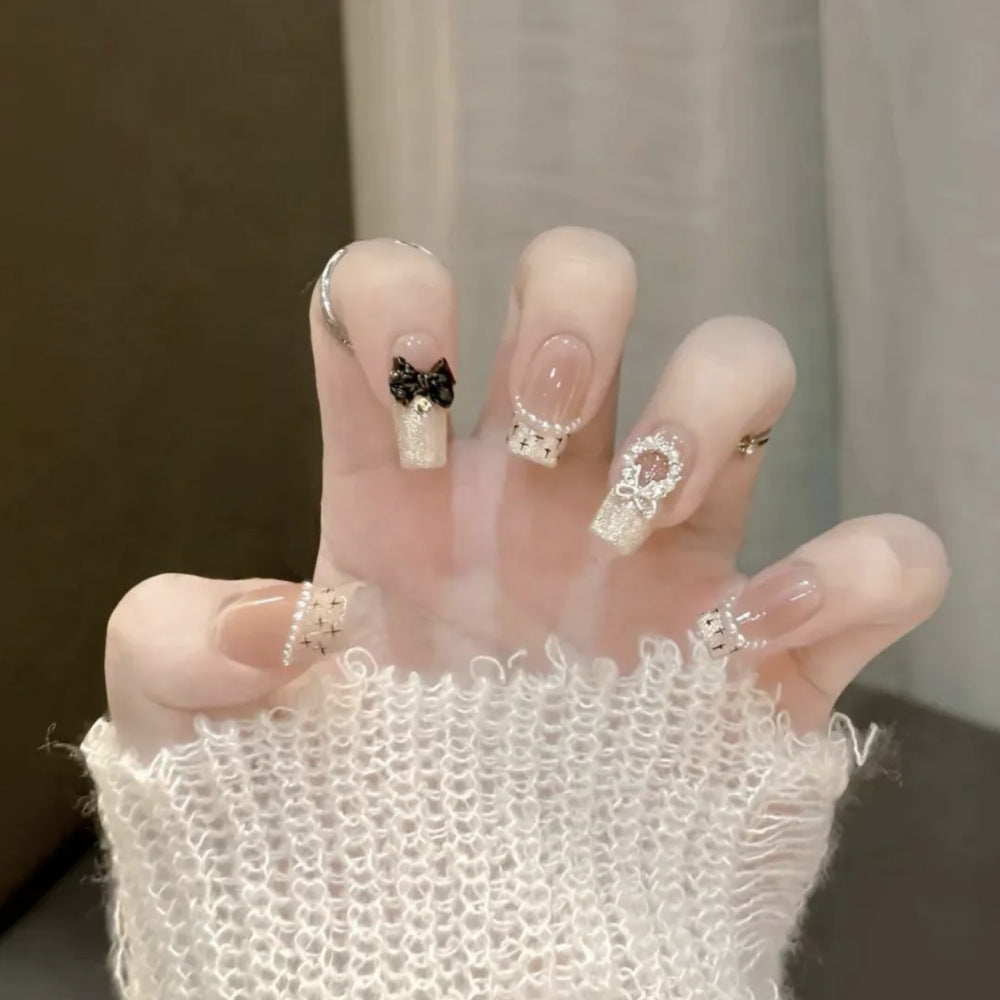 Artistic Press-On Nail Set with Floral and Heart Designs Bowlift