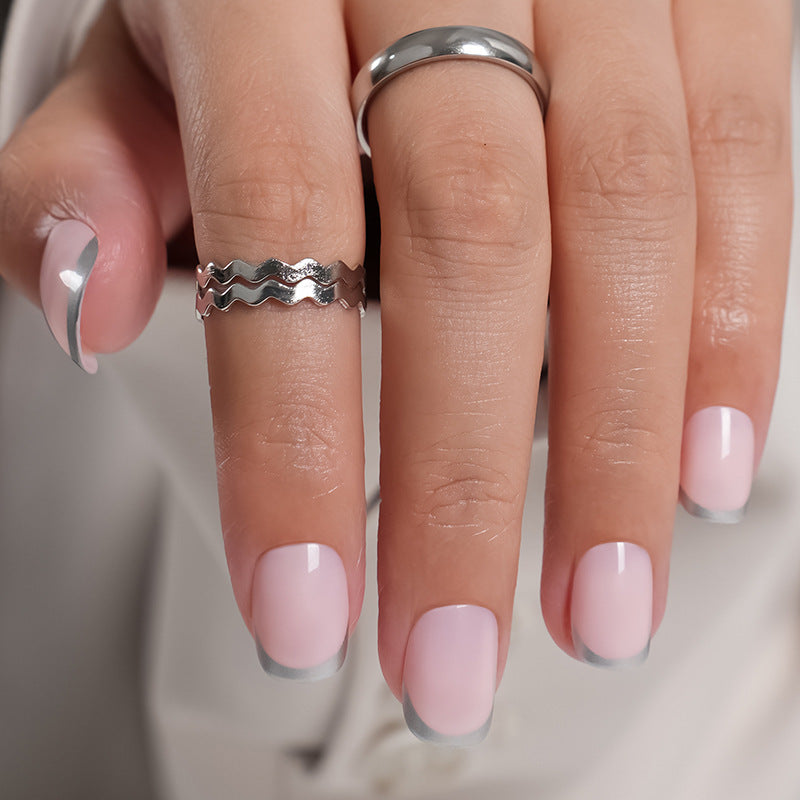 Artificial Nails in Natural French Tip Design Bowlift