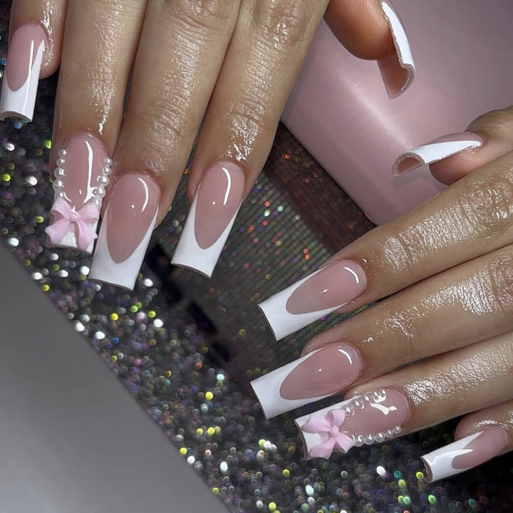 Elegant Stiletto Nail Art Extensions with Pearl and Bow Accents Bowlift