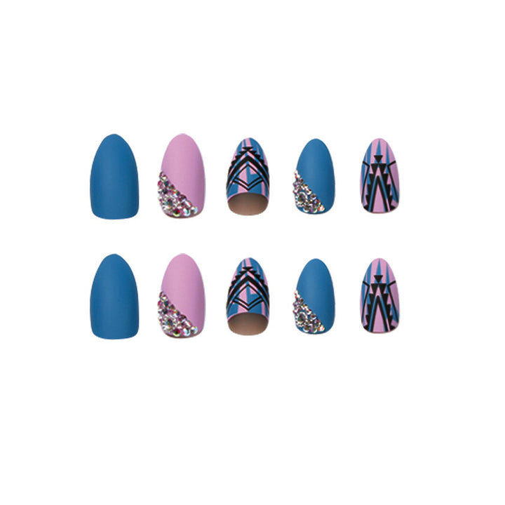 Artful stiletto nails with modern geometric designs and rhinestone embellishments Bowlift