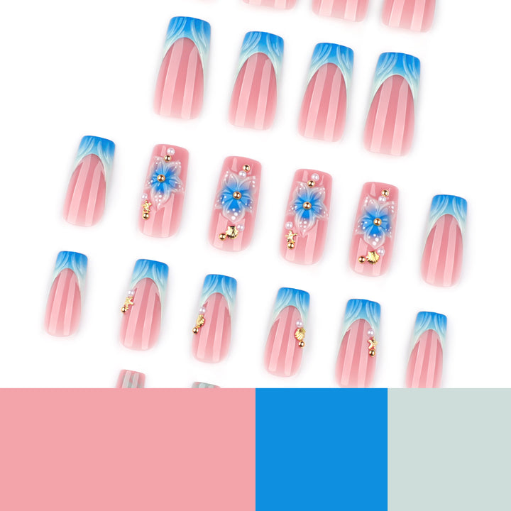 Artful nail art with floral accents and glitter effects Bowlift