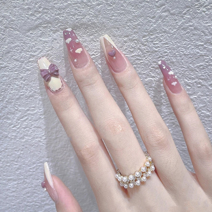 Artificial nails with heart accent and glamorous decorations Bowlift