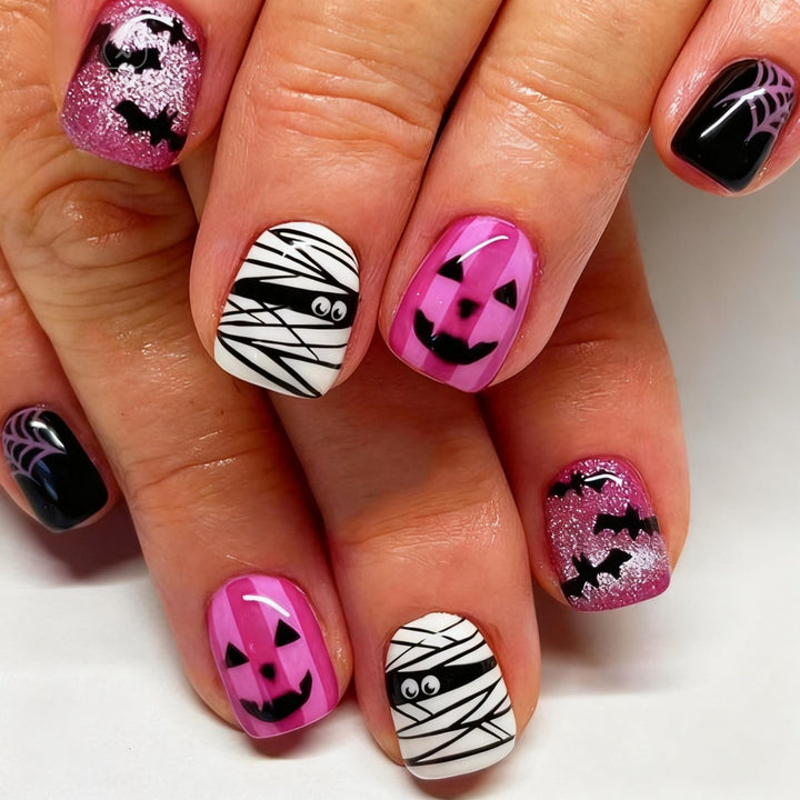 Creative nail art set with Halloween motifs and glitter accents Bowlift