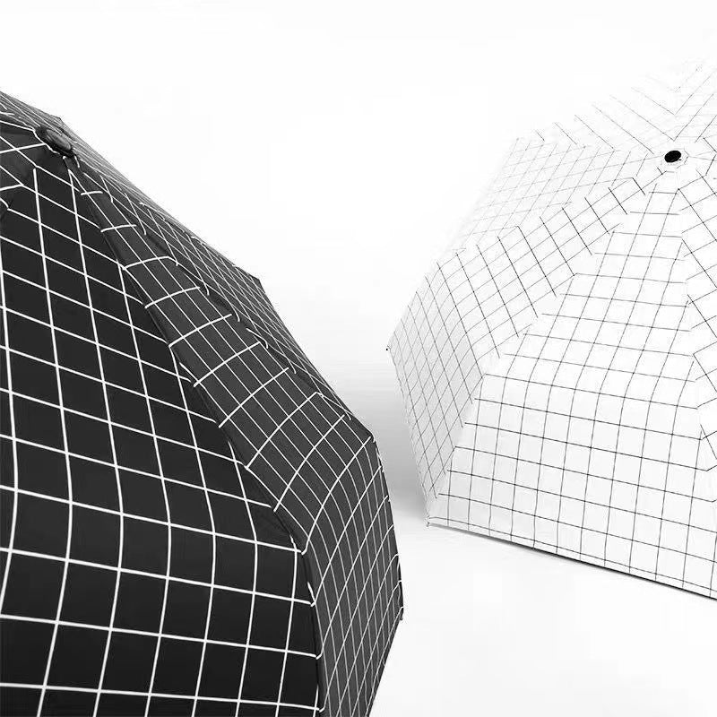 Compact Manual Eight-Rib Windproof Folding Umbrella with UV Protection and Grid Print Bowlift