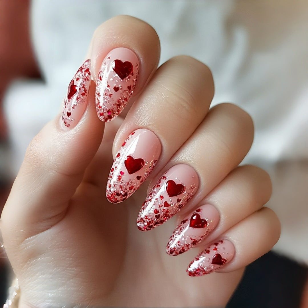Artificial nails with sparkling heart design and glitter coating Bowlift