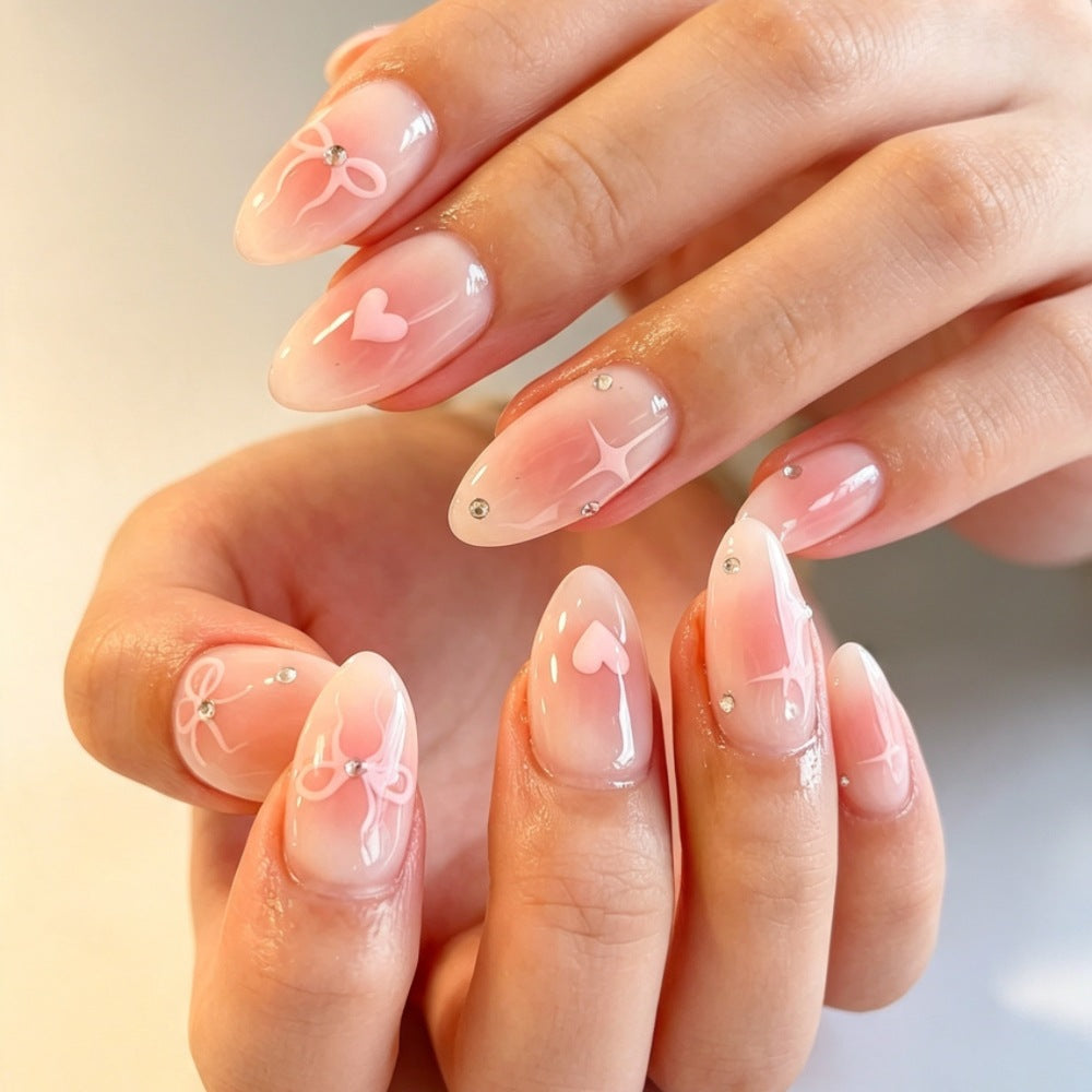 Artificial nails with romantic heart and bow design Bowlift