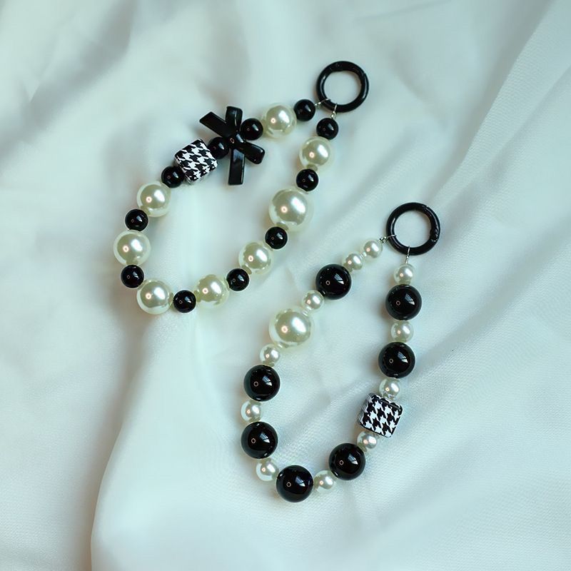 Elegant Pearl and Black Bead Charm Bracelet Bowlift