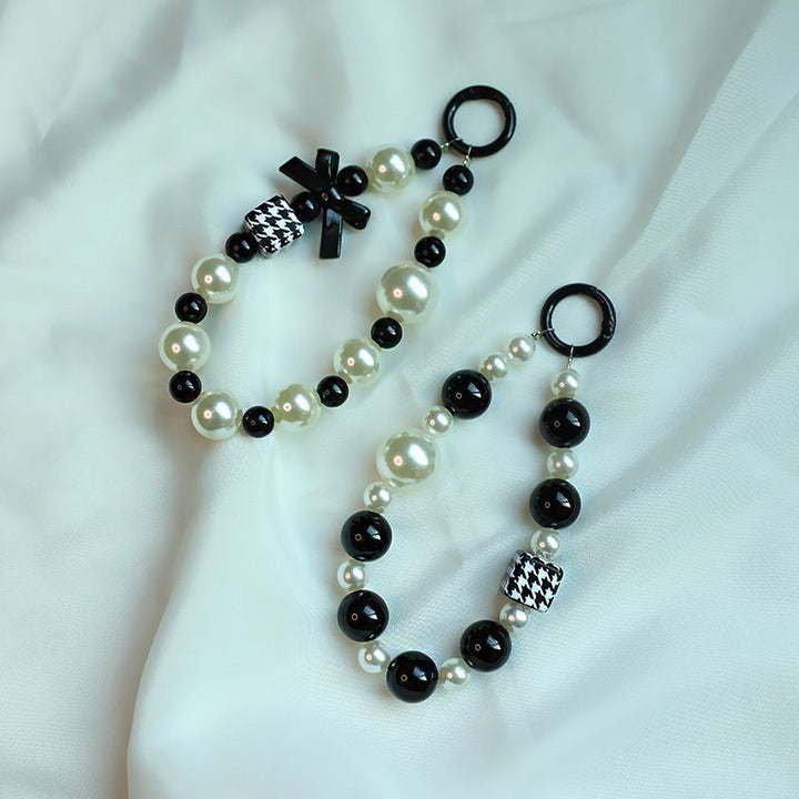 Elegant Pearl and Black Bead Charm Bracelet Bowlift