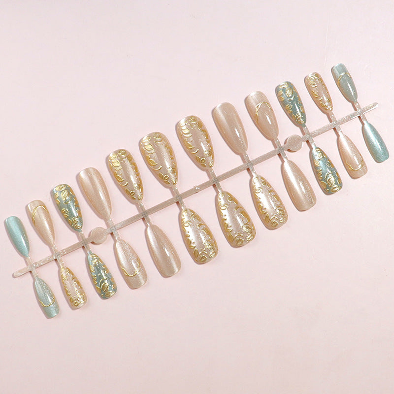 Artistic Stiletto Press-On Nail Set with Elegant Gold Accents Bowlift
