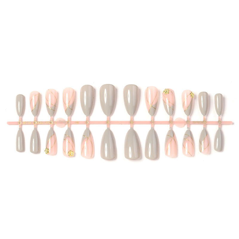 Artificial nail set with elegant marble design and gold accents Bowlift