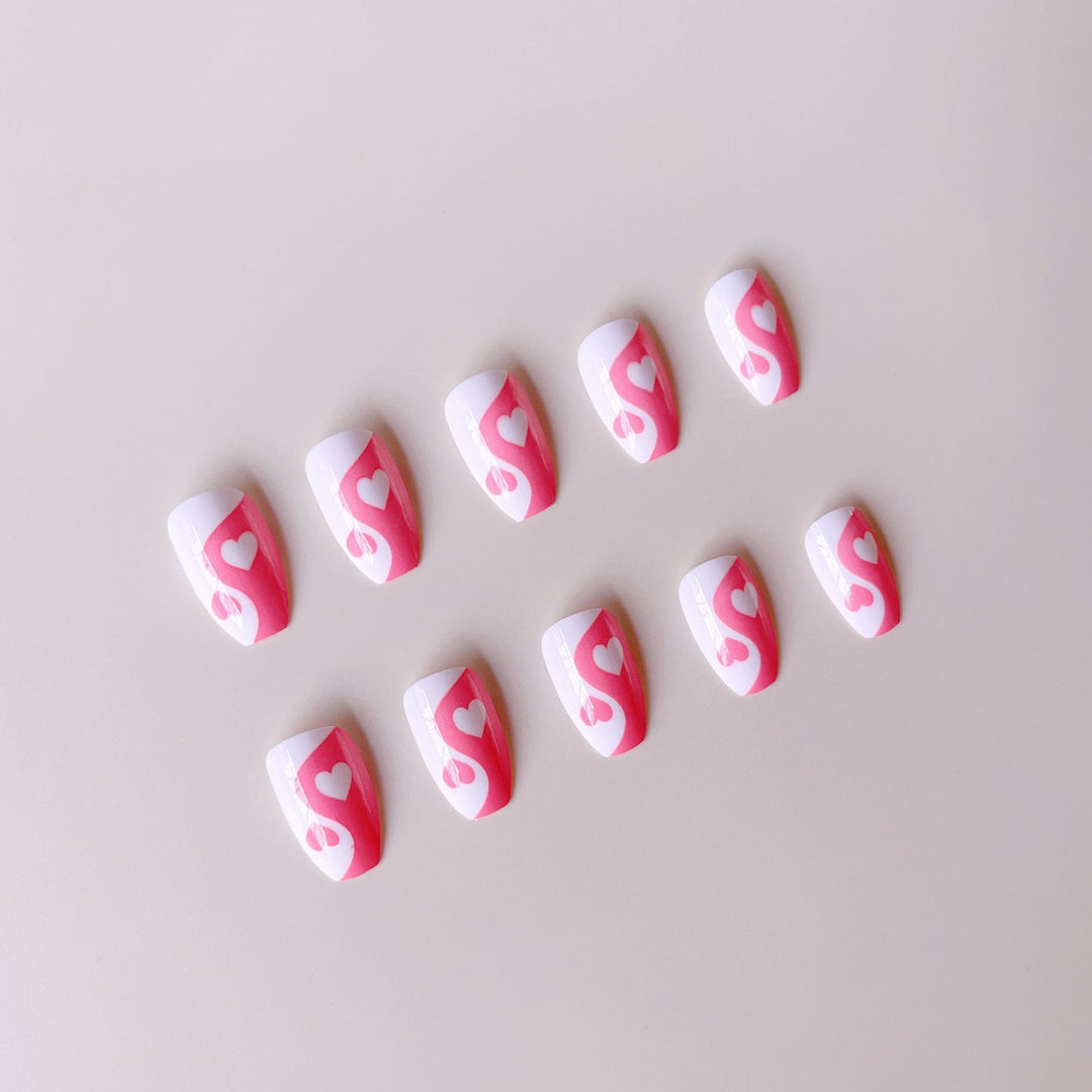 Artificial nails with heart motif and floral accents Bowlift