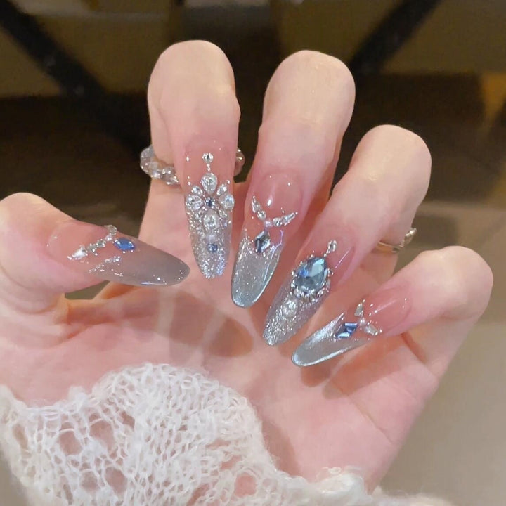 Glamorous artificial nails with sparkling rhinestone accents Bowlift