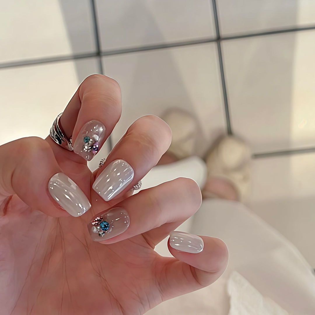 Artificial nails with elegant jewelry accents Bowlift