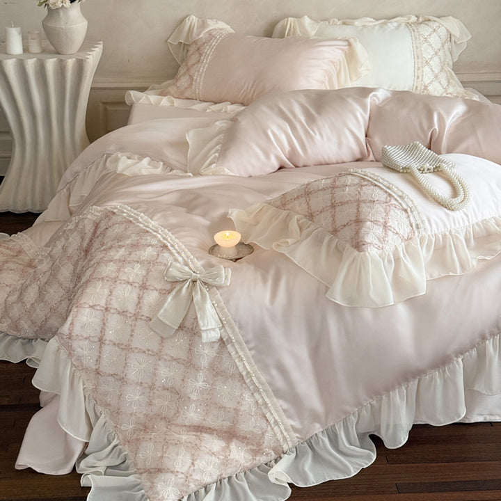 Romantic satin bedding set with ruffle, embroidered lace insert and bow appliqué