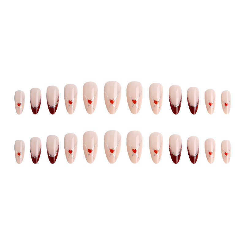 Acrylic nails with heart motifs and glitter details Bowlift