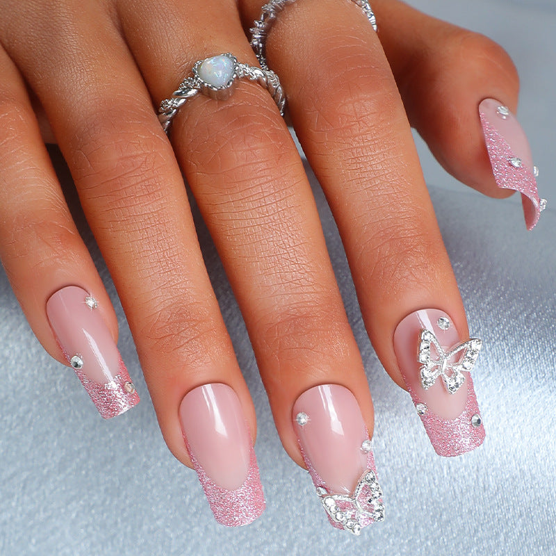Acrylic nail set with sparkling glitter accents and elegant butterfly motifs Bowlift