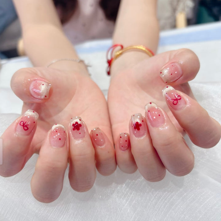 Artificial nails with sparkling accents and delicate patterns Bowlift