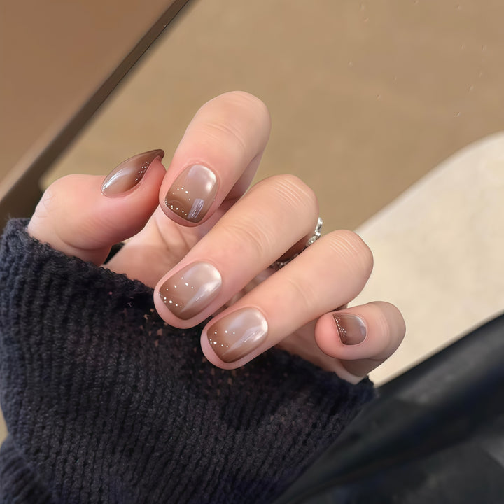 Artificial nails with elegant gradient color and glitter elements Bowlift