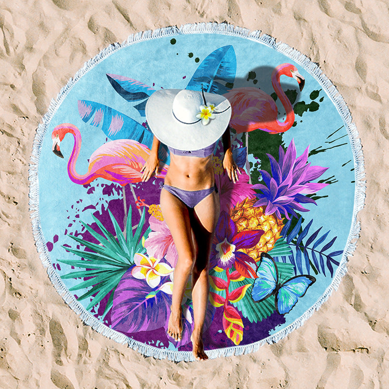Round beach towel with colorful, tropical floral pattern and fringe decoration Bowlift