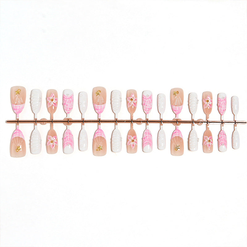 Artificial nail set with floral accents and glitter decorations Bowlift