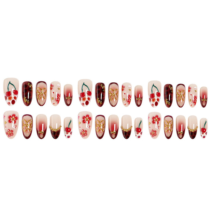 Artful nail tips with cheerful flower and cherry design Bowlift