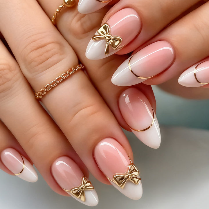 Artificial nail set with elegant gold edge and decorative accents Bowlift