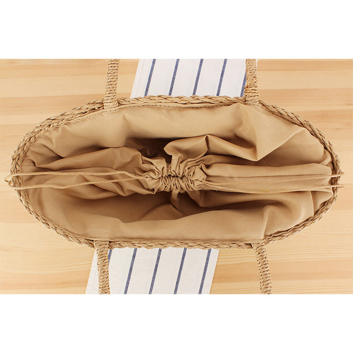 Hand-knotted shopping bag made of natural weave with elegant tassel decoration Bowlift