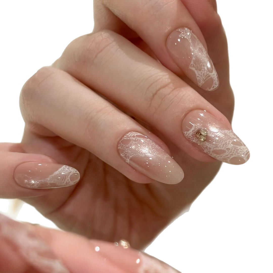 Elegant artificial nails with tips and glitter Bowlift