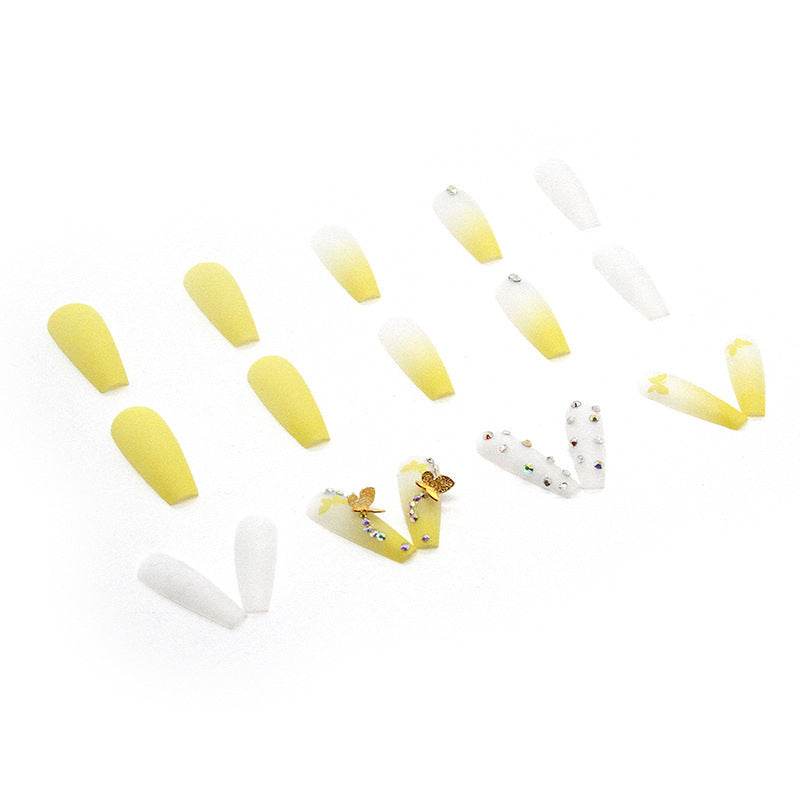 Artificial nail extensions with floral accents and rhinestones Bowlift