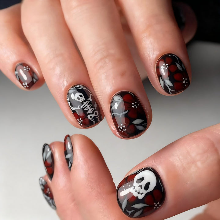 Creative nail art with skull motif and floral elements Bowlift