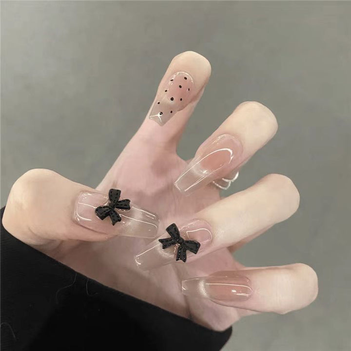 Artificial nails with playful bow design Bowlift